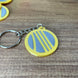 arc-raiders-raider-coin-keychain