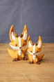 Ancient Kitsuu fox figures in two sizes with orange bodies, white face markings, brown details and large pointed ears