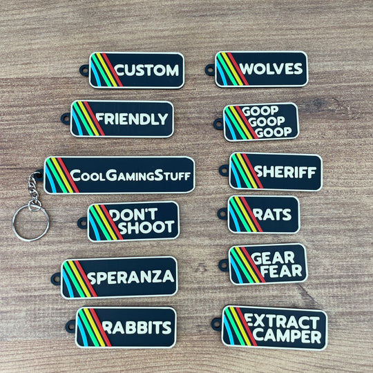 ARC Raiders inspired keyring with beige logo text