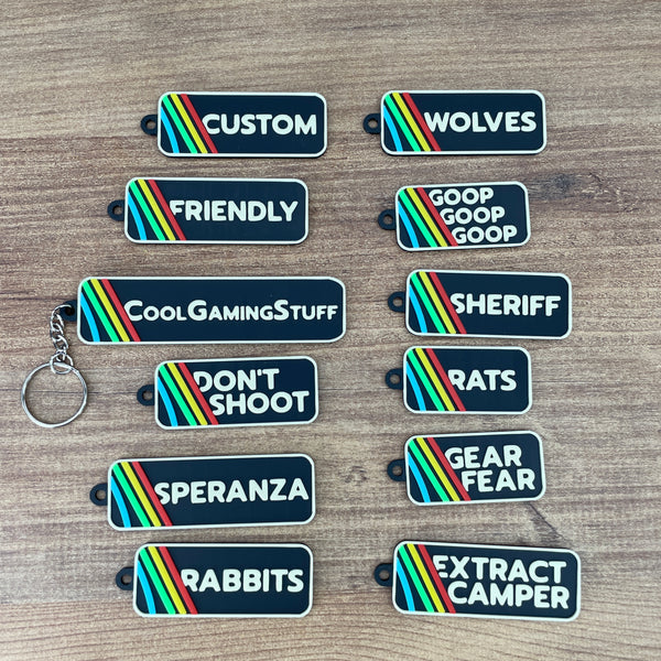 ARC Raiders inspired keyring with beige logo text