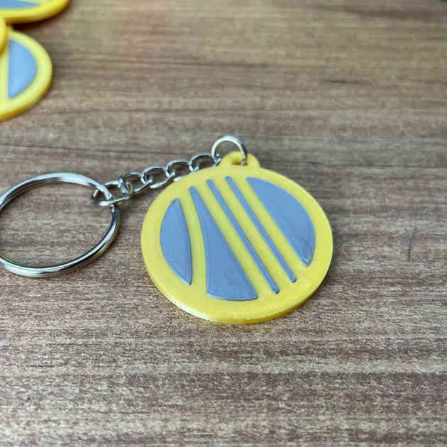 Arc Raiders Coin Keyring Upclose