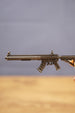 Close-up side view of the MK47 metal rifle keyring showing engraved details, magazine, stock and tactical rail design