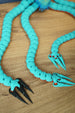Close-up of Collector Leviathan articulated tentacles with ribbed segments and sharp claw tips in turquoise and black