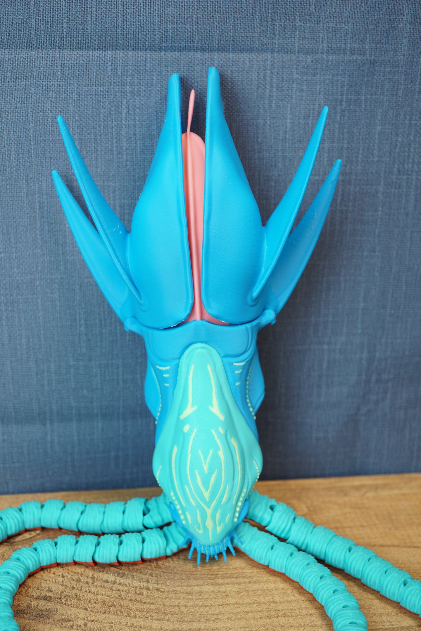 Front view of Collector Leviathan figure with raised blue fins, pink head crest, glowing face details, and long tentacles