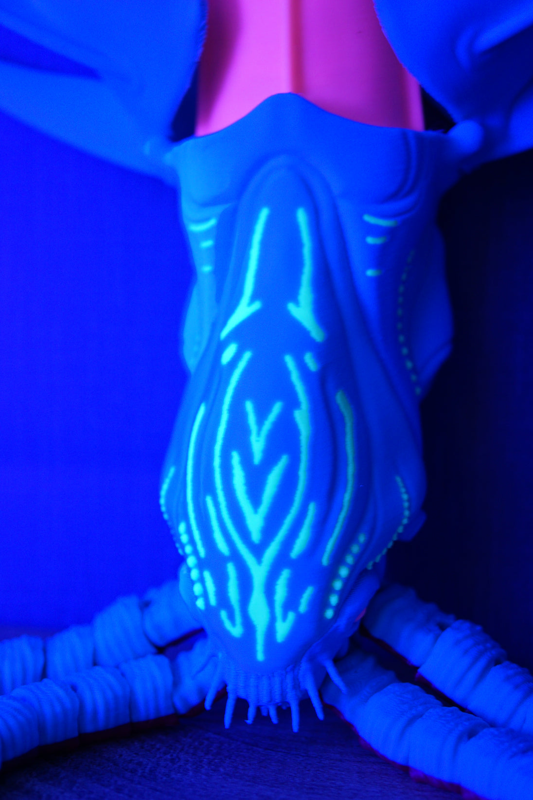 Close-up of Collector Leviathan face plate showing bright glow-in-the-dark bioluminescent style markings and tentacle details
