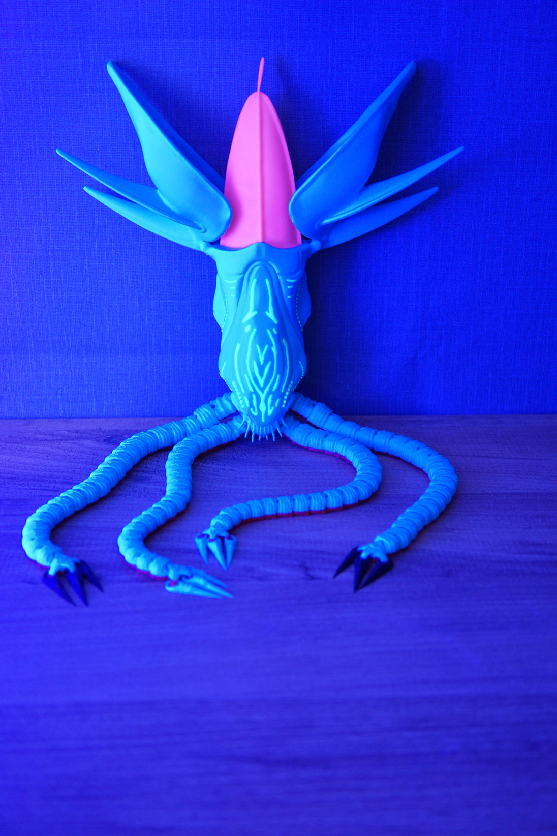 Collector Leviathan Subnautica fan figure with articulated tentacles, blue body, pink head crest, and glow markings under UV light