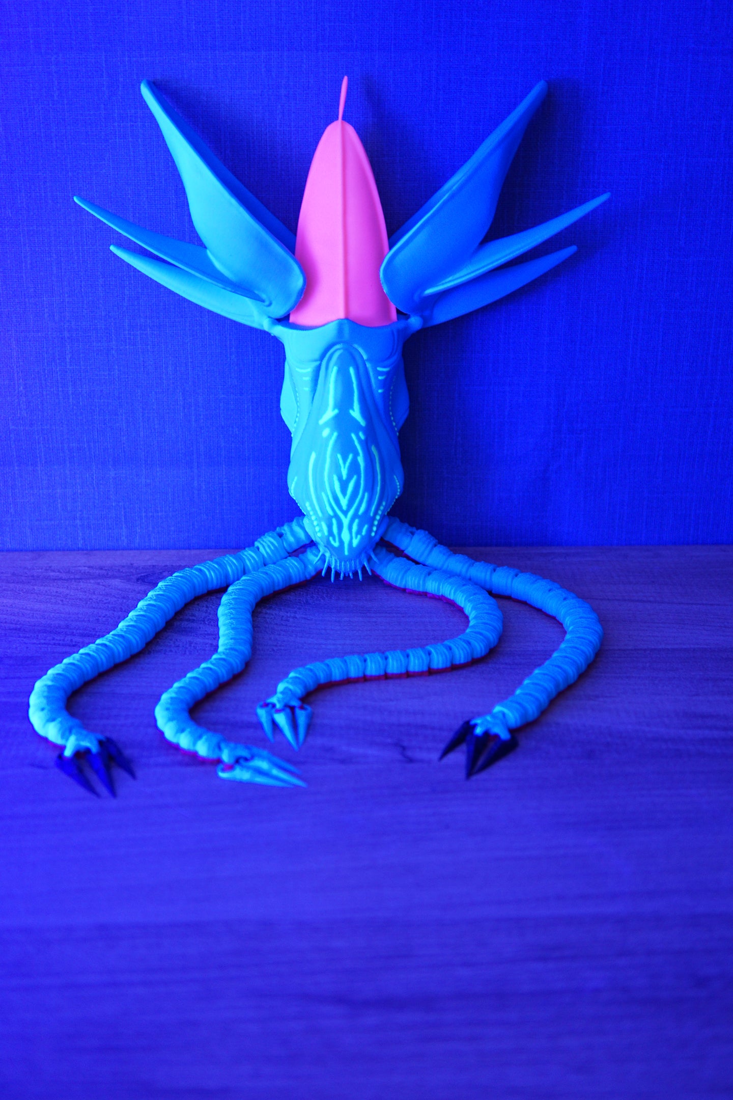 Collector Leviathan Subnautica fan figure with articulated tentacles, blue body, pink head crest, and glow markings under UV light