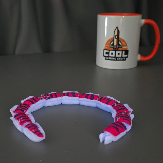 Crabsnake Articulated Toy with Glow-in-the-Dark Blue Accents
