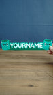 Front view of personalized Palia Cyl-inspired name sign with two cute green cylinder characters, designed as a custom gamer desk decoration