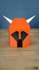 Front view of a red Dragon Med Helm OSRS replica with black face detail and white horns, made as RuneScape fan display decor
