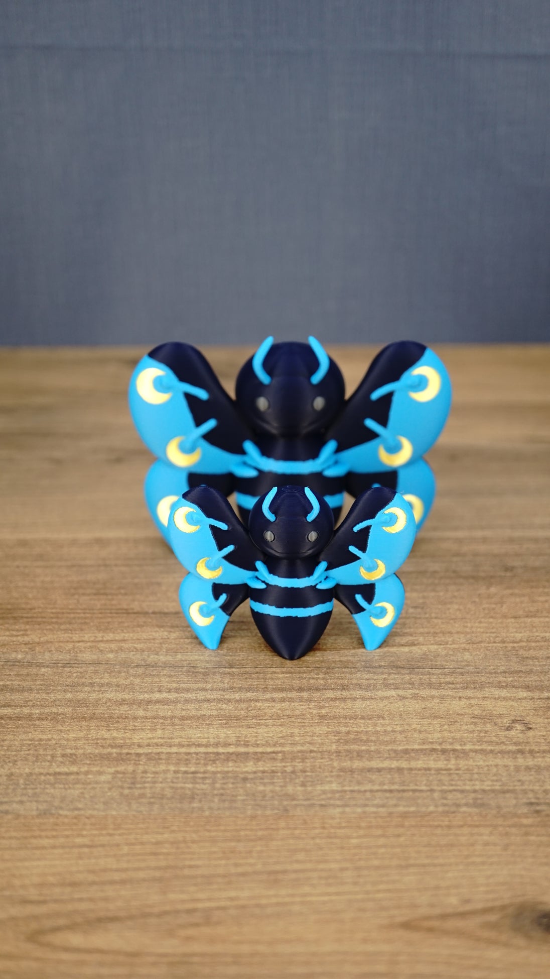Front view of 8cm and 12cm Duskwing Butterfly collectible figures arranged together to show the two available size options.