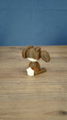 Rear view of the Elder Sernuk-inspired Palia plush figure showing its rounded head, ears, and cream tail.
