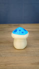 Back view of the Elderwood Fun Guy figurine with a cream body and blue spotted mushroom cap