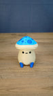 Front view of an Elderwood Fun Guy figurine with a blue spotted mushroom cap, cream body, black eyes, and blue feet.