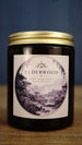 Elderwood vegan soy wax candle in an amber glass jar with gold lid, featuring moss, damp earth and cedarwood woodland fragrance.