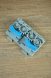 Close-up of Factorio blue belt splitter component