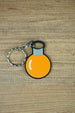 Factorio metallurgic science flat keyring orange design