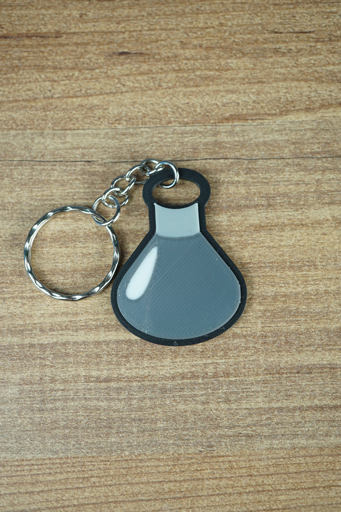 Factorio military science flat keyring dark grey design