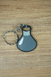 Factorio military science flat keyring dark grey design