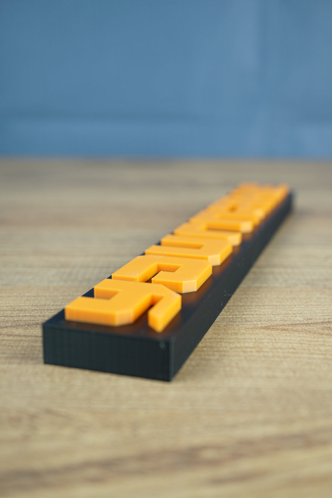 Close-up of Factorio nameplate showing detailed 3D printed finish