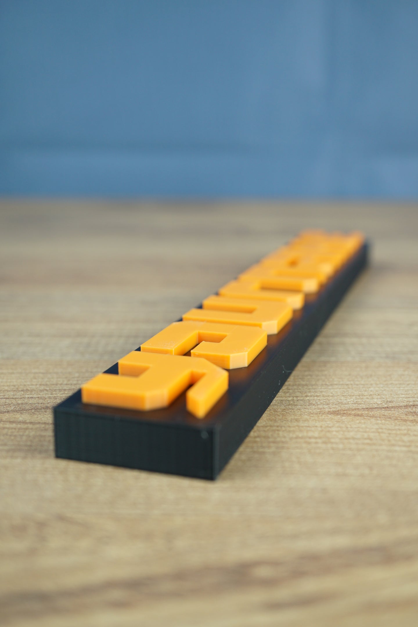Close-up of Factorio nameplate showing detailed 3D printed finish