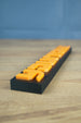 Close-up of Factorio nameplate showing detailed 3D printed finish