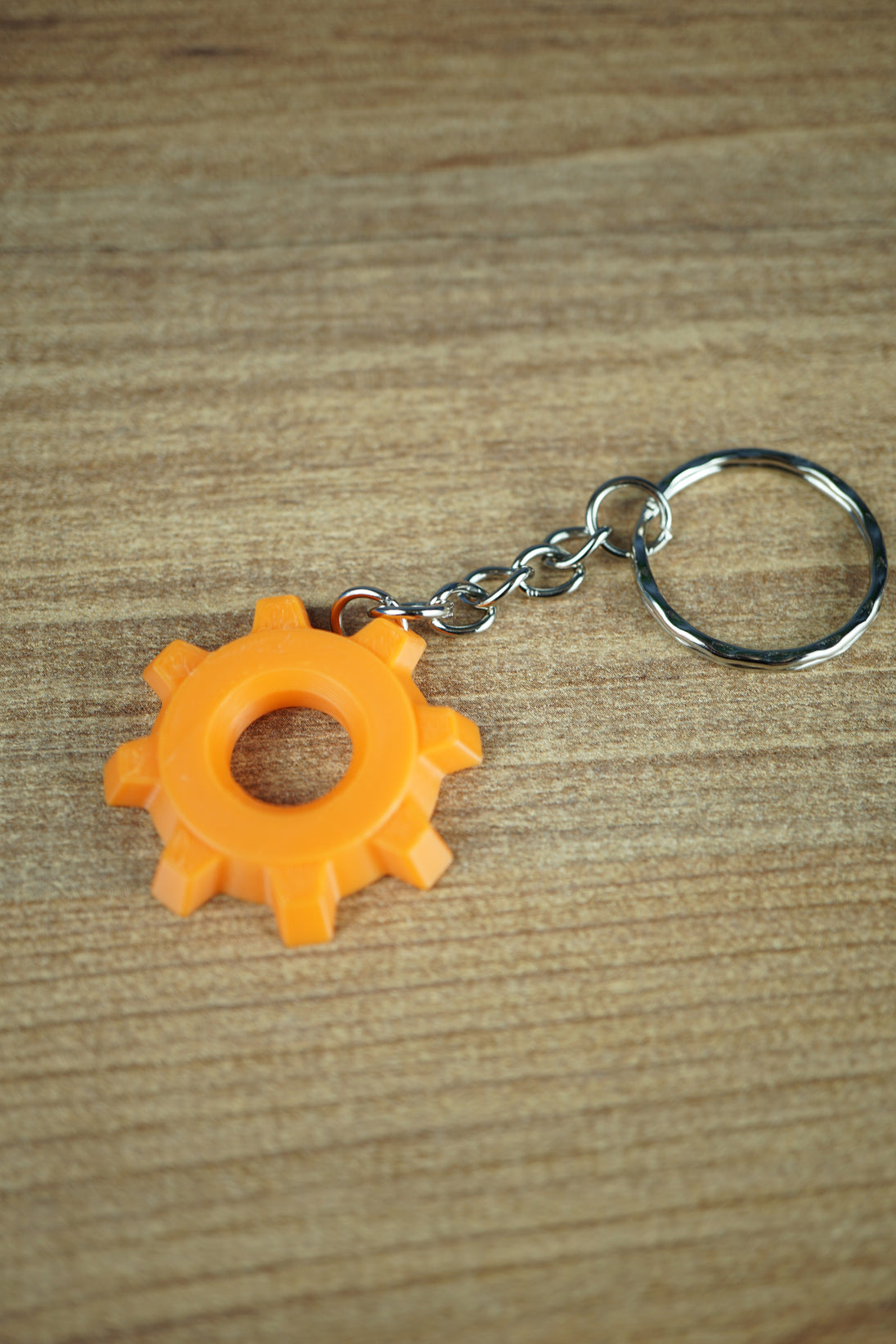 Factorio gear cog displayed on gaming desk setup