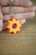 Front view of Factorio orange gear cog collectible