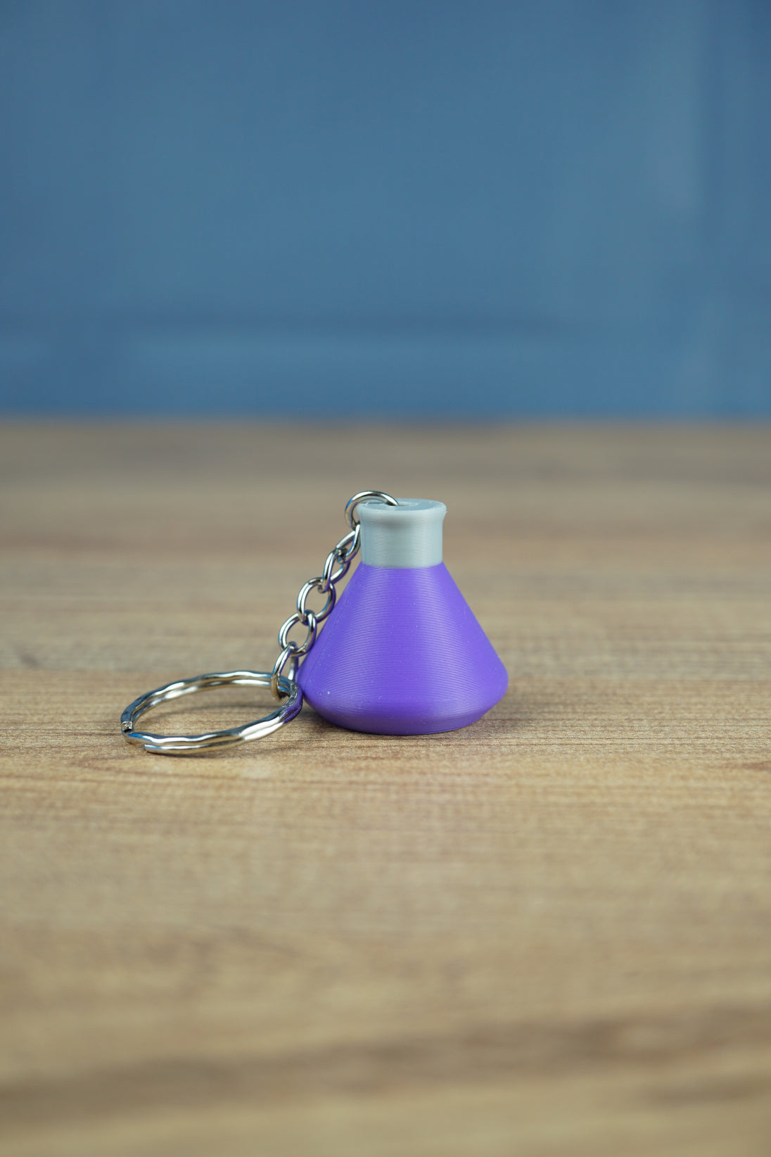 Factorio production science pack keyring purple flask