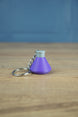 Factorio production science pack keyring purple flask