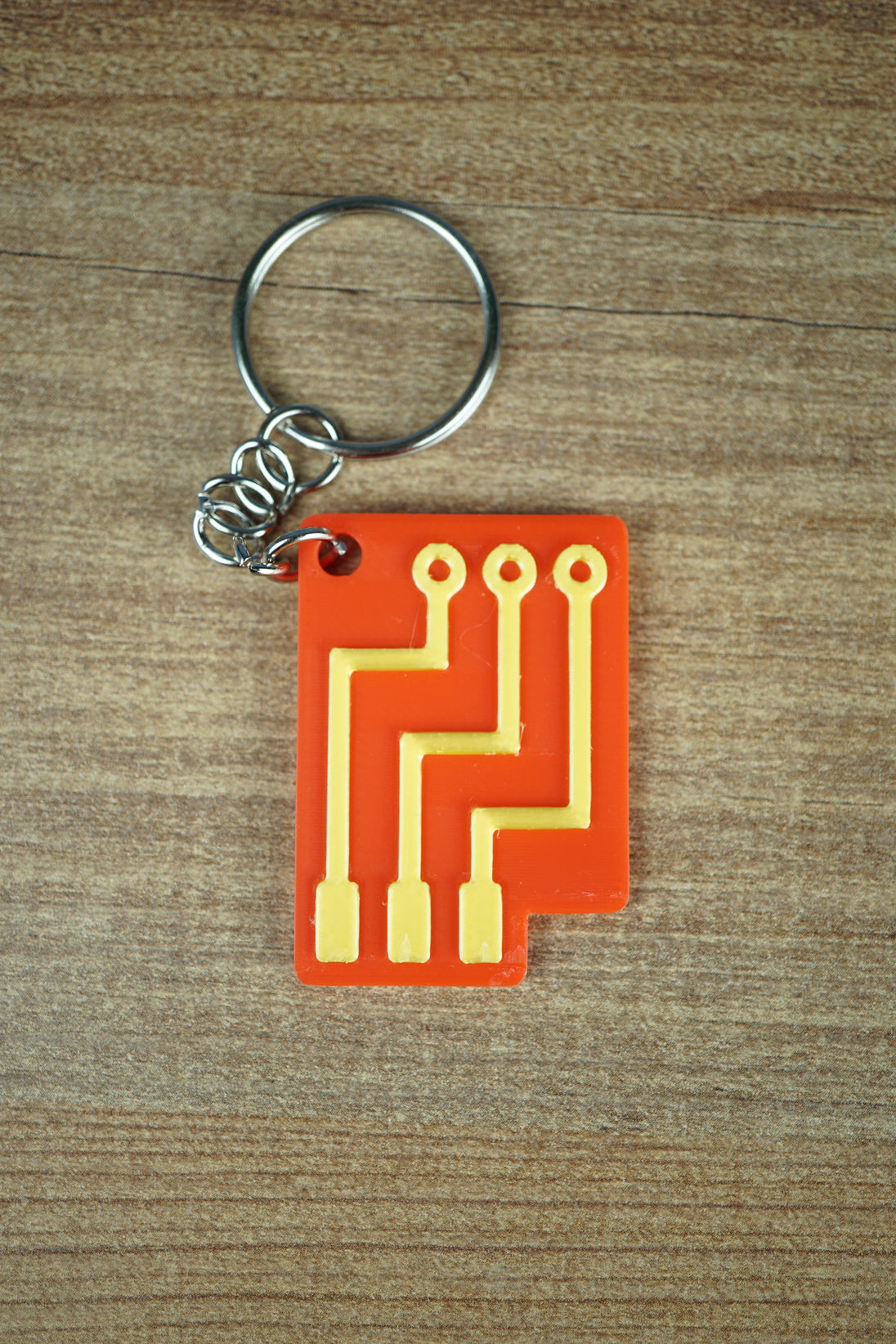 Factorio red advanced circuit keyring with embossed gold detailing