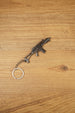 Detailed HK G36 keychain displayed diagonally on wood, metal rifle keyring gift for military game and shooter fans