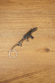 Detailed HK G36 keychain displayed diagonally on wood, metal rifle keyring gift for military game and shooter fans