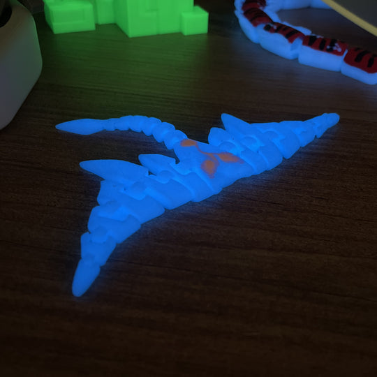 Glow-in-the-dark Subnautica Ghostray toy on shelf