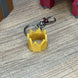 Gold RuneScape party hat collectible keychain
