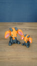 Golden Sernuk-inspired Palia plush figure with orange head, gray body, pink ears, and gray horns.