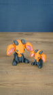 Golden Sernuk-inspired Palia plush figure with orange head, gray body, pink ears, and gray horns.