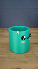 Right-side view of the green Palia-inspired Cyl pencil holder, highlighting the character face, pink rim detail and smooth rounded container shape.