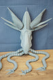 Grey Collector Leviathan Subnautica fan figure with articulated tentacles, sharp claw tips, raised head fins, and detailed creature body on display.