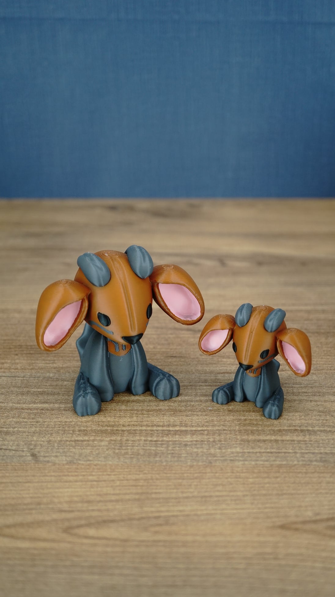 Highlands Sernuk-inspired Palia plush figure with bright blue head, dark body, pink ears, and blue horns.