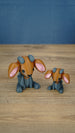 Highlands Sernuk-inspired Palia plush figure with bright blue head, dark body, pink ears, and blue horns.