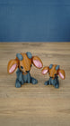 Highlands Sernuk-inspired Palia plush figure with bright blue head, dark body, pink ears, and blue horns.
