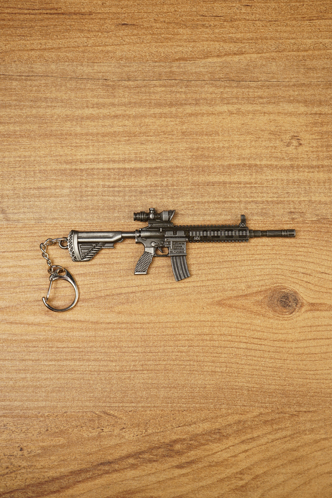 HK 416A5 rifle keyring replica shown side-on with matte black tactical detailing, chain clip and miniature FPS gaming collectible design