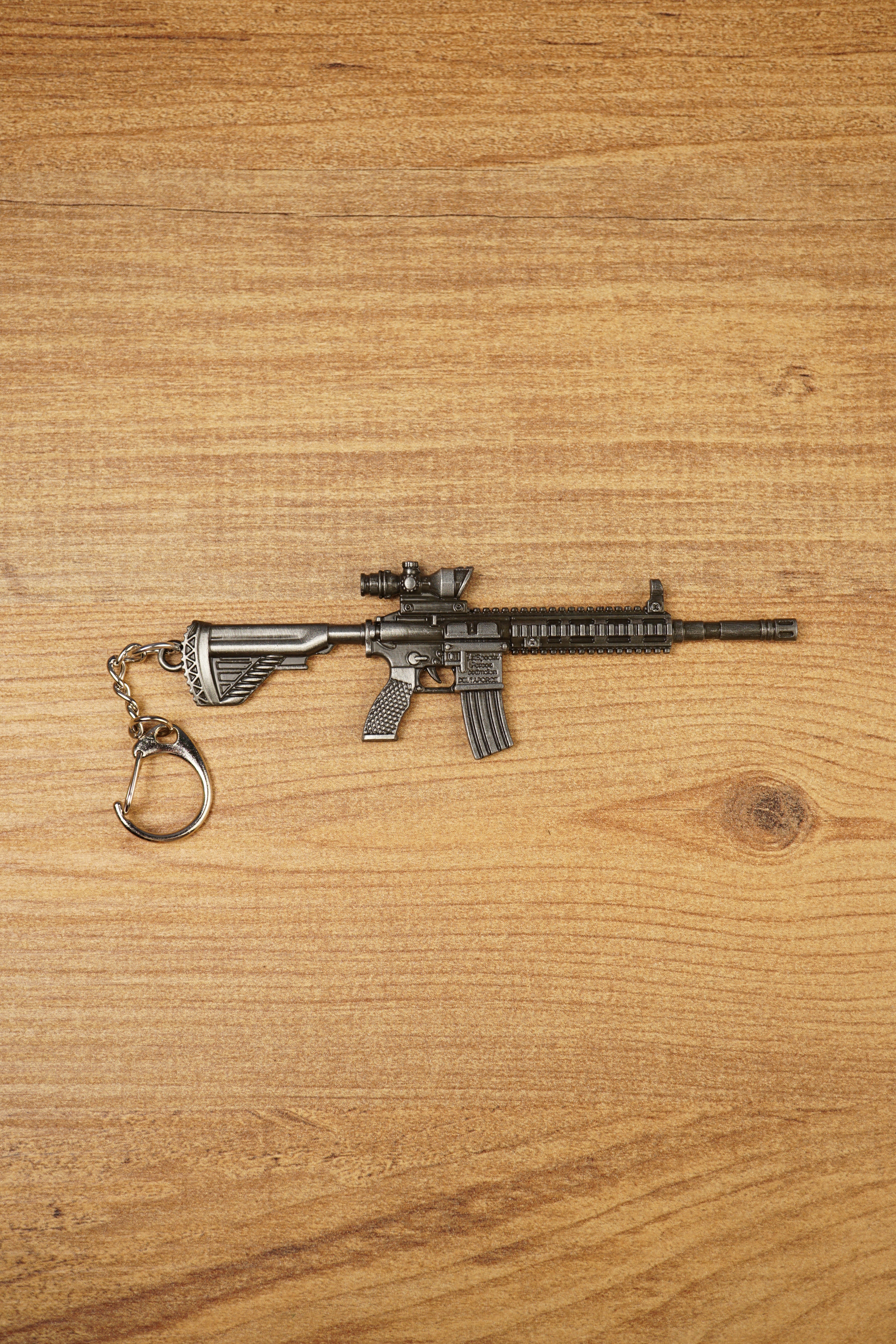 HK 416A5 rifle keyring replica shown side-on with matte black tactical detailing, chain clip and miniature FPS gaming collectible design