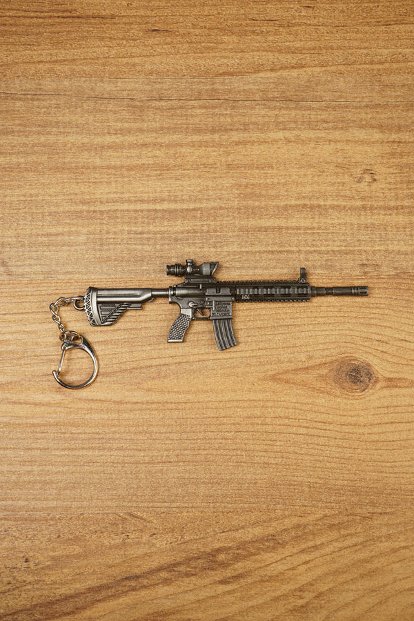HK 416A5 rifle keyring replica shown side-on with matte black tactical detailing, chain clip and miniature FPS gaming collectible design