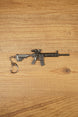 HK 416A5 rifle keyring replica shown side-on with matte black tactical detailing, chain clip and miniature FPS gaming collectible design