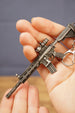 Detailed HK 416A5 rifle keyring replica in hand with tactical FPS gaming style, matte black metal finish and collector keychain design