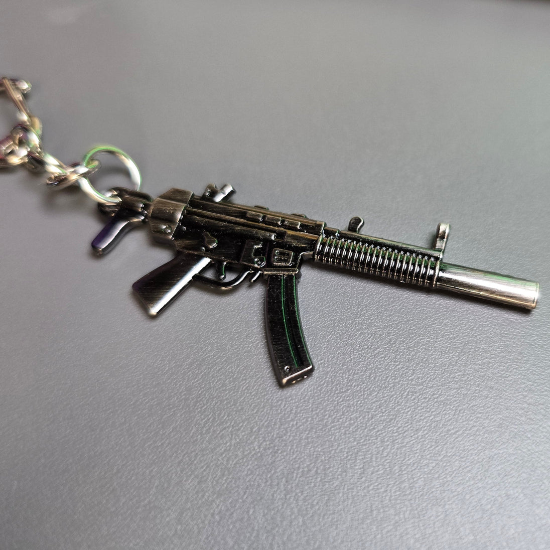 HK MP5 9x19 Silenced Submachine Gun Keychain Replica on Backpack