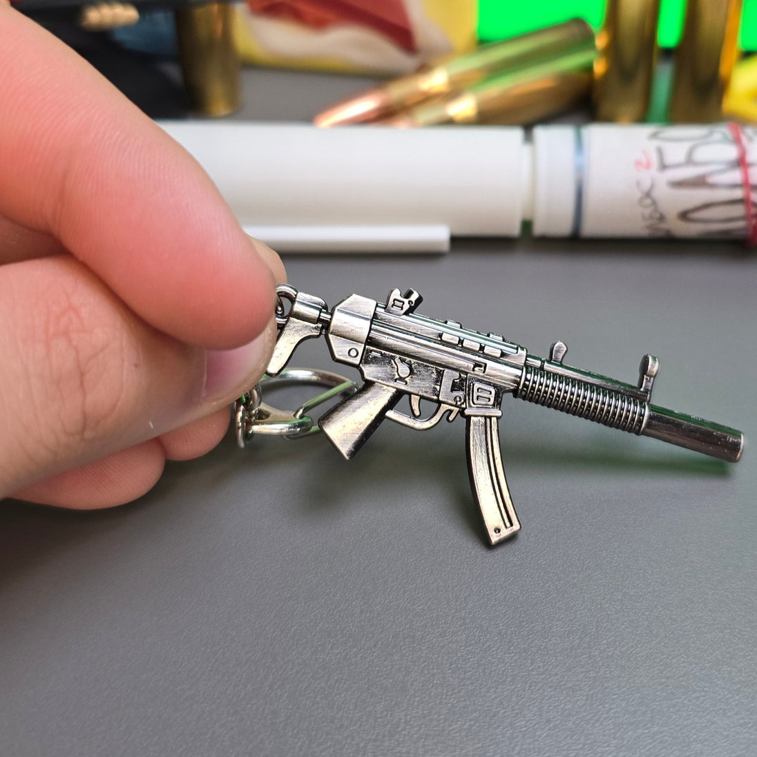 HK MP5 9x19 Silenced Submachine Gun Keychain Replica In Hand