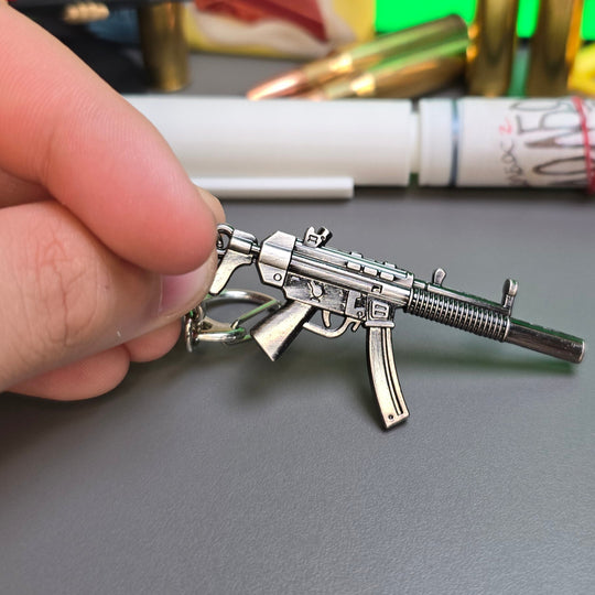 HK MP5 9x19 Silenced Submachine Gun Keychain Replica In Hand